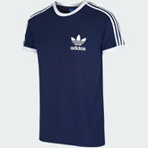 Adidas California Casual T-Shirt Men's in collegiate navy, front view showing ribbed crew neck, short sleeves with white 3-Stripes, and an embroidered Trefoil logo on the chest.